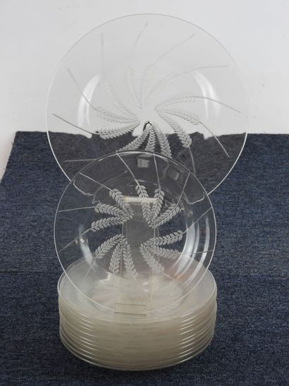 null LALIQUE: Part of a table service in transparent molded glass decorated with...