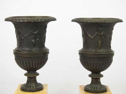 null Pair of Medici vases in chased and patinated bronze with a farandole of satyrs...