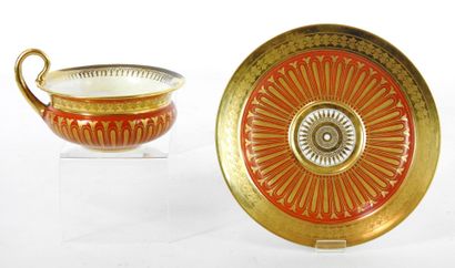 null 
SEVRES : Cup and saucer in orange and gold porcelain. Monograms AG and G. Restoration...