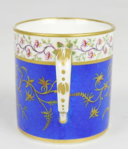 null SEVRES : Porcelain cup and saucer decorated with a bird on a blue background....