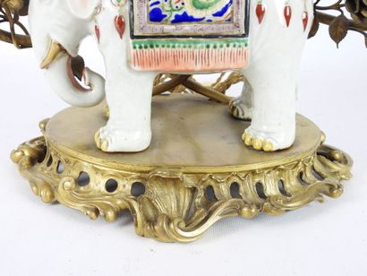 null CANDELABER in the shape of elephant in polychrome porcelain surmounted by a...