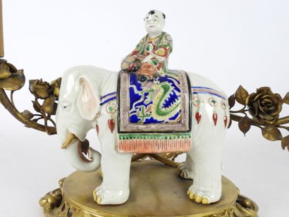 null CANDELABER in the shape of elephant in polychrome porcelain surmounted by a...
