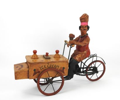 null TOY representing an ice cream merchant in painted paper maché, ice cream cart...