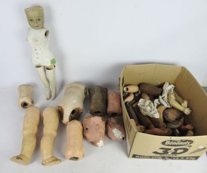 null LOT of boiled cardboard doll parts including body, arms, legs, heads and miscellaneous....
