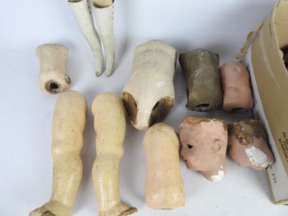 null LOT of boiled cardboard doll parts including body, arms, legs, heads and miscellaneous....