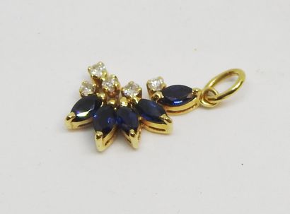 null Pendant in yellow gold 18K (750 thousandths) set with sapphires cut in navette...