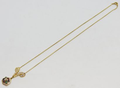 null Necklace in yellow gold 18K (750 thousandths) in the motives in scroll paved...