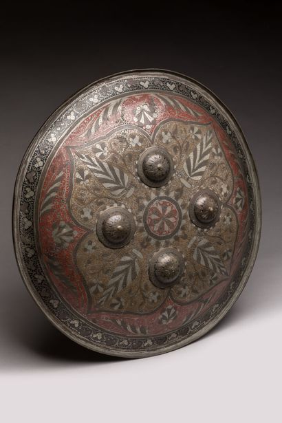 null MOGHOL, North India.


Metal nielloed, 


Convex rondache with four umbos on...