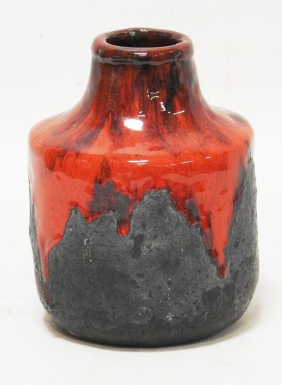 null Earthenware vase with a flattened belly with a red and black cover.

Marked...