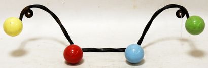 null Coat rack with four wrought iron pegs, decorated with four colored wooden balls.

52...