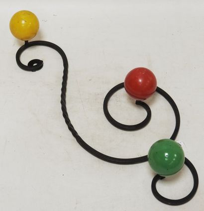 null Coat rack with three pegs in wrought iron decorated with three colored wooden...
