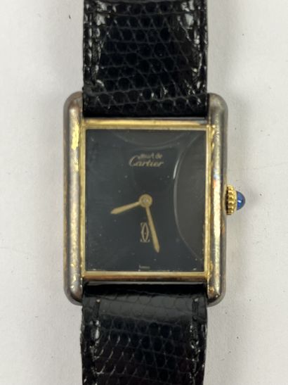 null CARTIER Paris : Lady's wristwatch "Must" line, the rectangular case in silver...