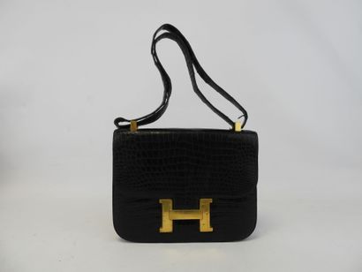 null HERMES. Constance bag in black Porosus crocodile. Gold metal trim. Hand-carried...