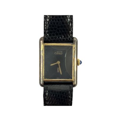 null CARTIER Paris : Lady's wristwatch "Must" line, the rectangular case in silver...