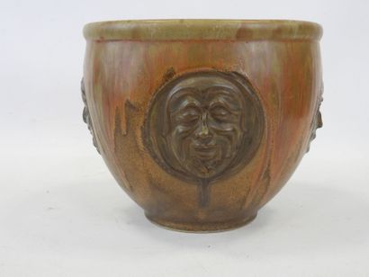 null DENBAC, Pierced pot cover in red and green glazed stoneware with relief decoration...