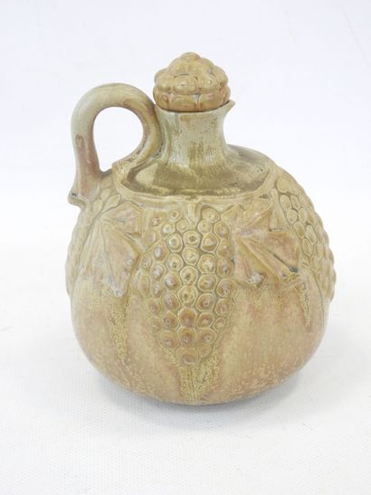 null DENBAC, Stoneware jug with relief decoration of grapevines complete with its...