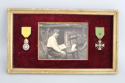 null DECORATIONS. War cross with star, military medal in a frame framing the photo...