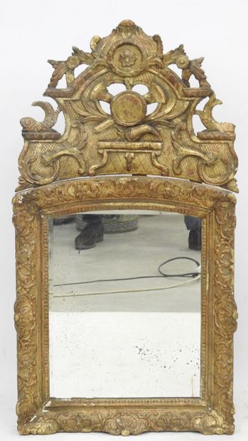 null MIRROR in a beautiful frame with openwork pediment, in gilded, molded and carved...