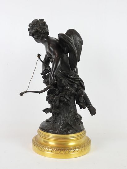 null SCULPTURE in patinated bronze representing Cupid holding his bow in the left...