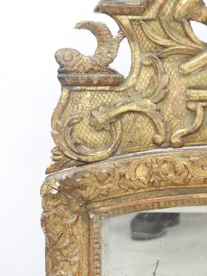 null MIRROR in a beautiful frame with openwork pediment, in gilded, molded and carved...