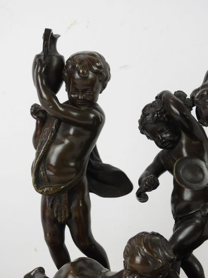null SCULPTURE in bronze with brown patina representing four playing putti, accompanied...