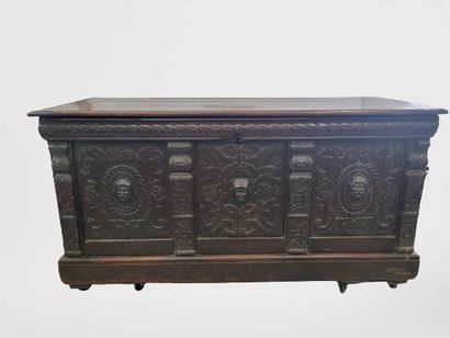 null Natural wood molded and carved chest, the front with three panels centered with...