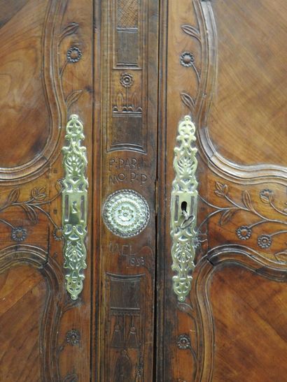 null RENNAISE CABINET in molded and carved fruitwood with flowers, the cornice with...