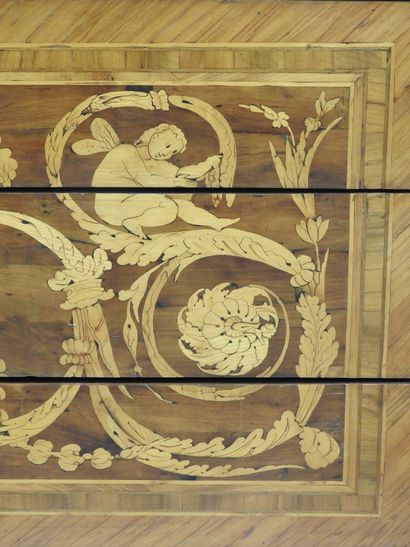 null 
WOODEN COMMODE in veneer and marquetry decorated with vases, scrolls and putti,...