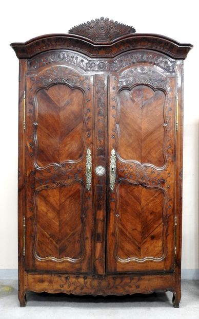 null RENNAISE CABINET in molded and carved fruitwood with flowers, the cornice with...