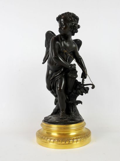 null SCULPTURE in patinated bronze representing Cupid holding his bow in the left...