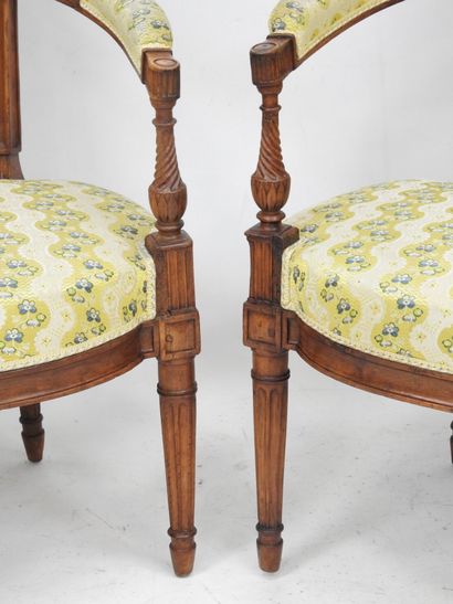 null Pair of cabriolet armchairs, with "gendarme hat" backs decorated with pomegranates,...