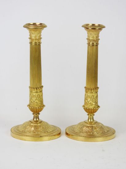 null Rare pair of BIG CANDLES in chased and gilded bronze, the tapered shaft finished...