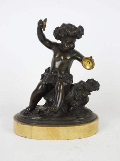 null SCULPTURE in bronze with medal patina representing the young Bacchus, sitting...