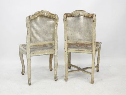 null Meeting of TWO CANNED CHAIRS in molded, carved and rechambered natural wood,...