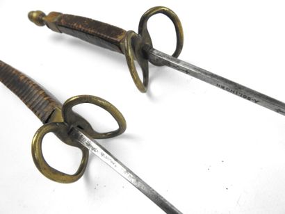 null FENCING. Pair of foils for young men with wooden handles covered with brown...