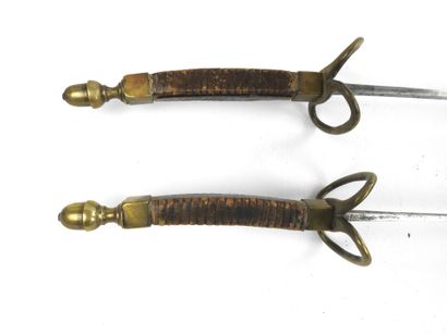 null FENCING. Pair of foils for young men with wooden handles covered with brown...