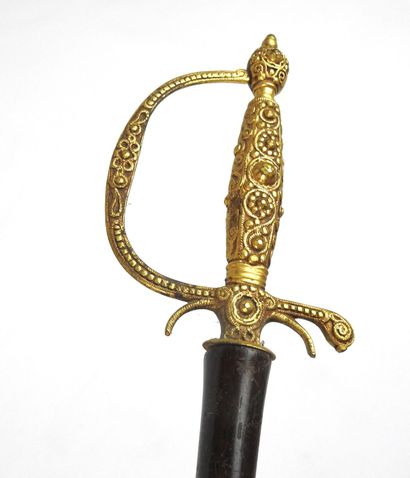 null CURIOSITIES. Umbrella whose handle is made with a handle and a sword guard of...