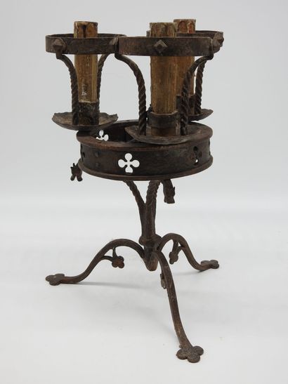 null Pair of wrought iron candlesticks in neo-Gothic style, the main crown with three...