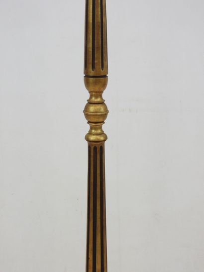 null LAMP STAND in molded wood, fluted and gilded with a baluster shaft resting on...
