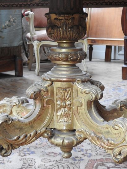 null MIDDLE TABLE with gilded wood base richly molded with rocaille and flowers,...