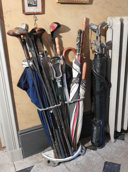LOT of golf clubs and umbrellas. 25 pieces...