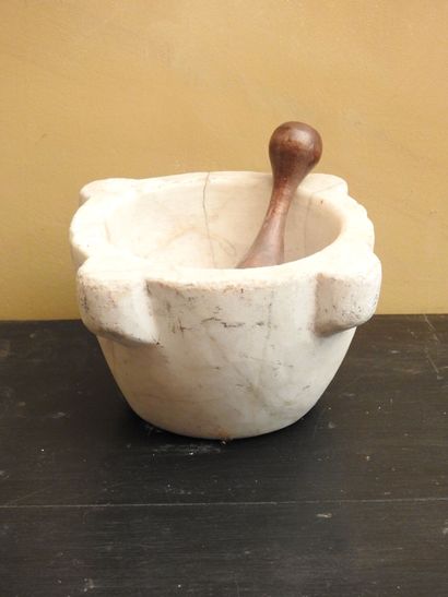 MORTIER in white marble with wooden pestle....