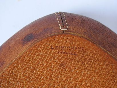 null 
LONGCHAMP - France : brown ceramic ashtray covered with saddle-stitched leather....