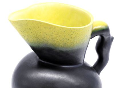 null Pol CHAMBOST (1906-1983). Pitcher in black enamelled ceramics, yellow enamelled...