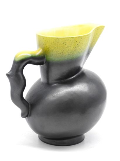 null Pol CHAMBOST (1906-1983). Pitcher in black enamelled ceramics, yellow enamelled...