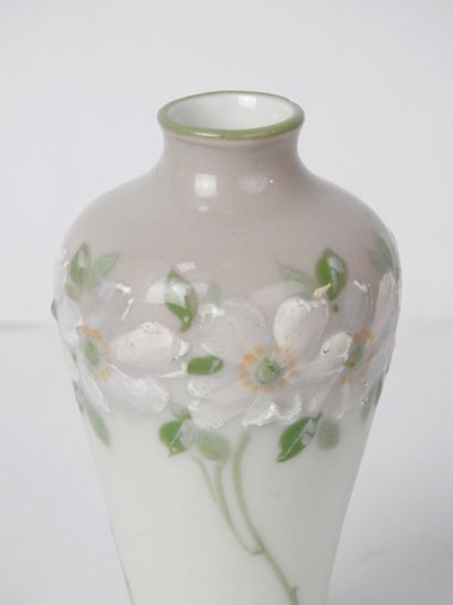 null VASE with high body in porcelain with decoration in relief of a frieze of flowers,...