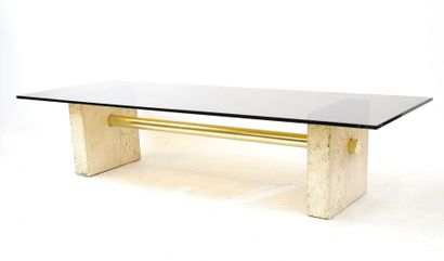 null LOW TABLE with rectangular top in smoked glass resting on two travertine feet...