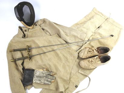 null FENCING. Complete fencer's outfit circa 1920-1930 including a small mesh mask...