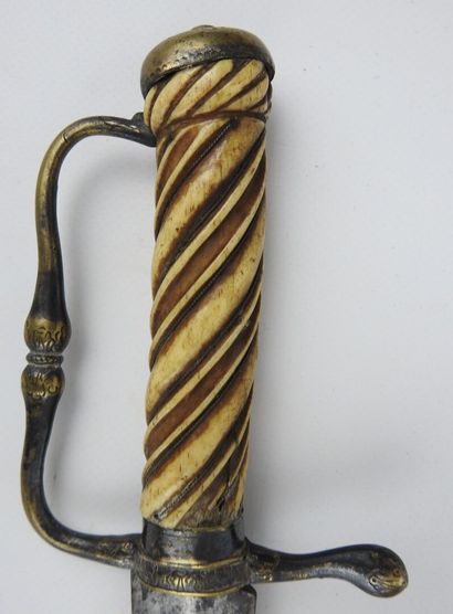 null FRANCE. Short saber of venery with handle in twisted and filigreed walrus ivory,...