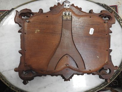 null Carved wooden frame with heraldic decoration in the neo-gothic style presenting...
